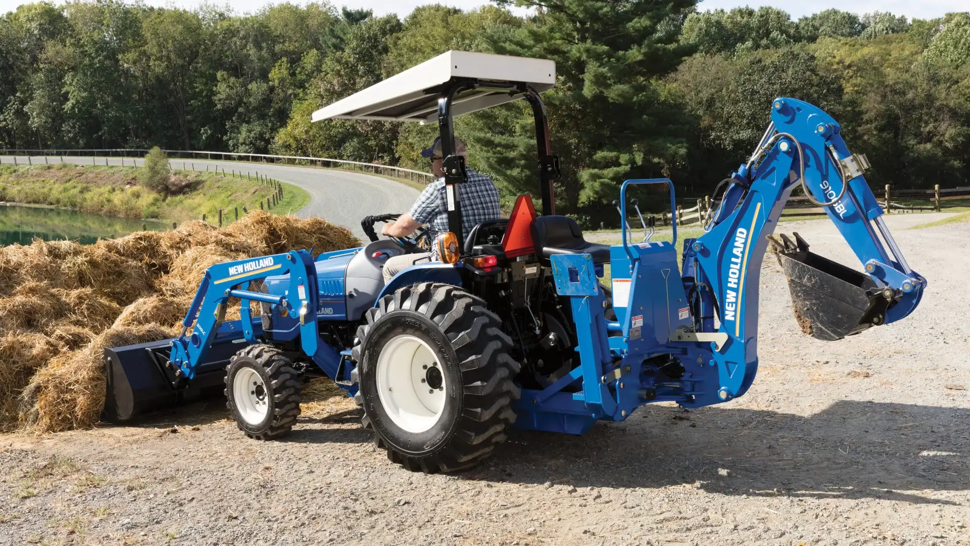 WORKMASTER compact tractor with loader and backhoe attachments